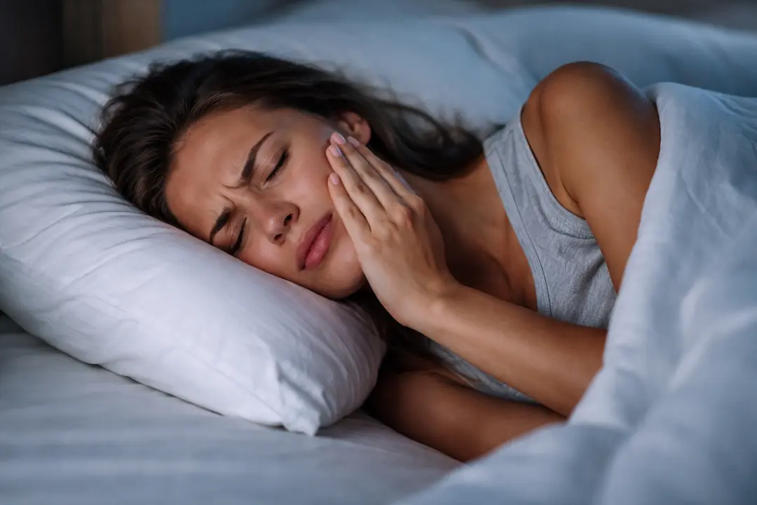 Why does tooth pain get worse at night?
